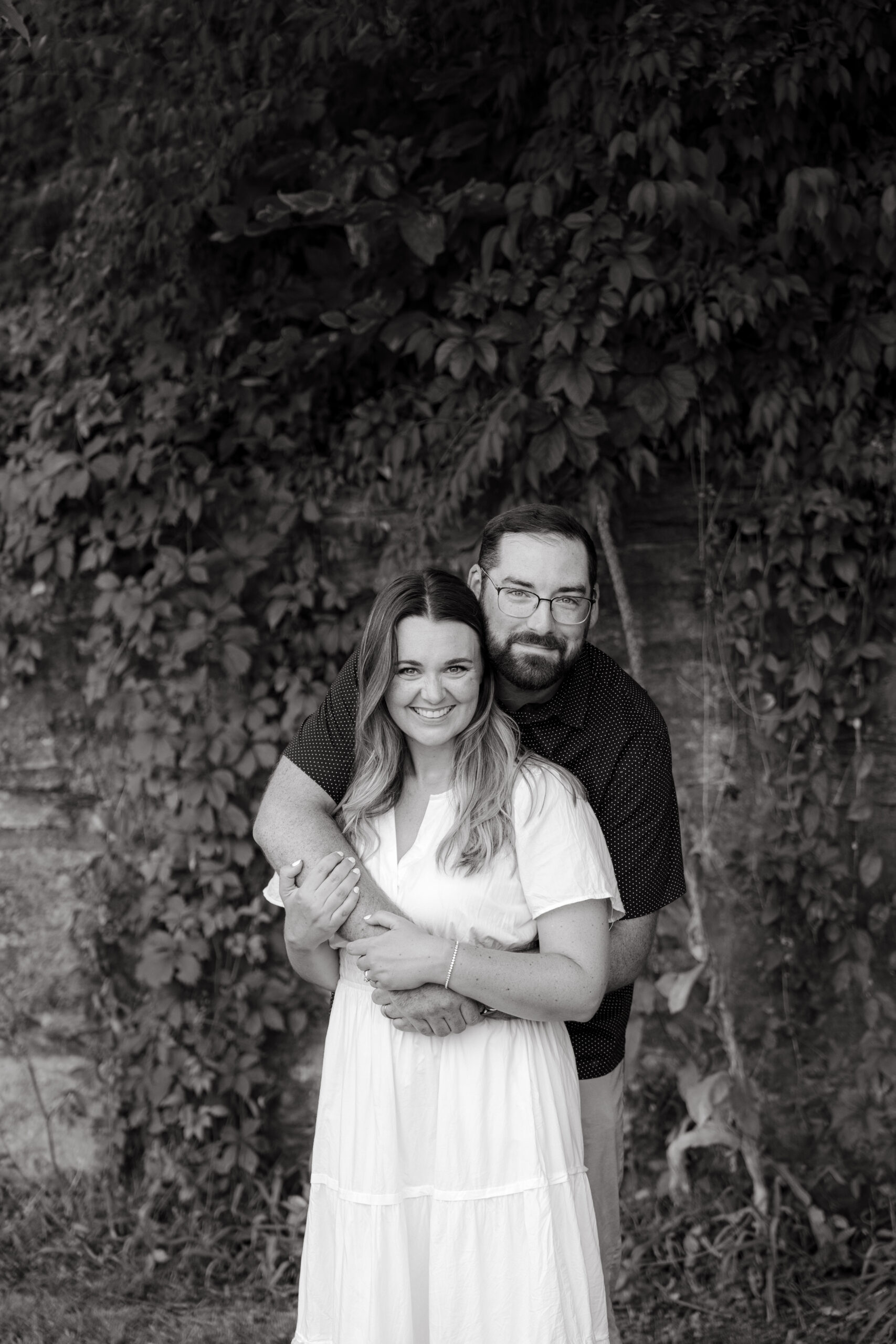Family playing tag during outdoor photo session at a park in Evansville, Indiana by Brittney Moseby Photography
