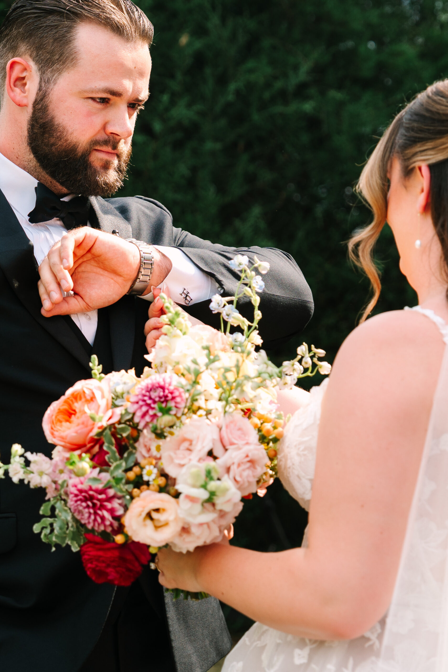 Colorful bridal bouquet with pink and orange flowers