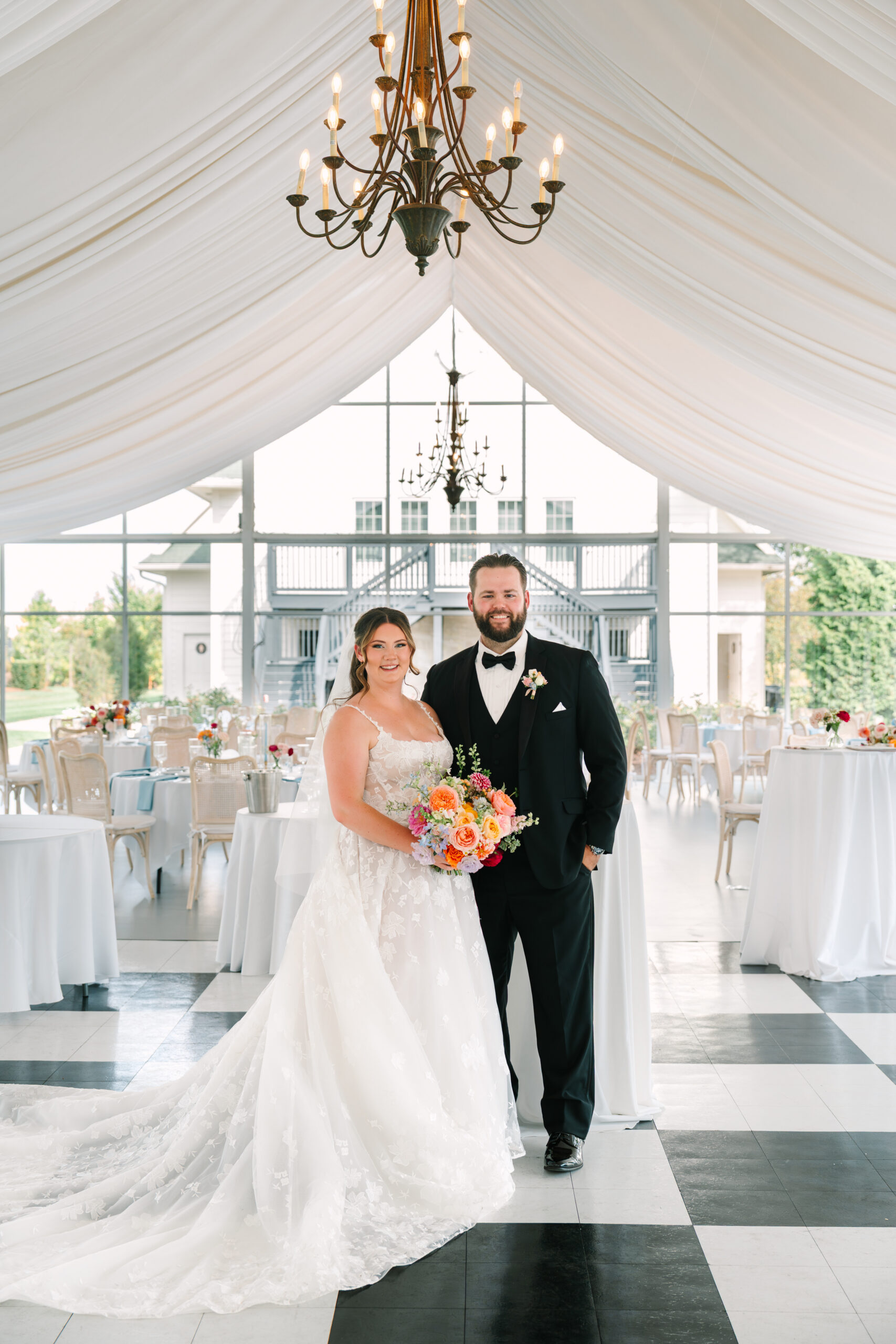 Colorful bridal bouquet with pink and orange flowers Ritz Charles