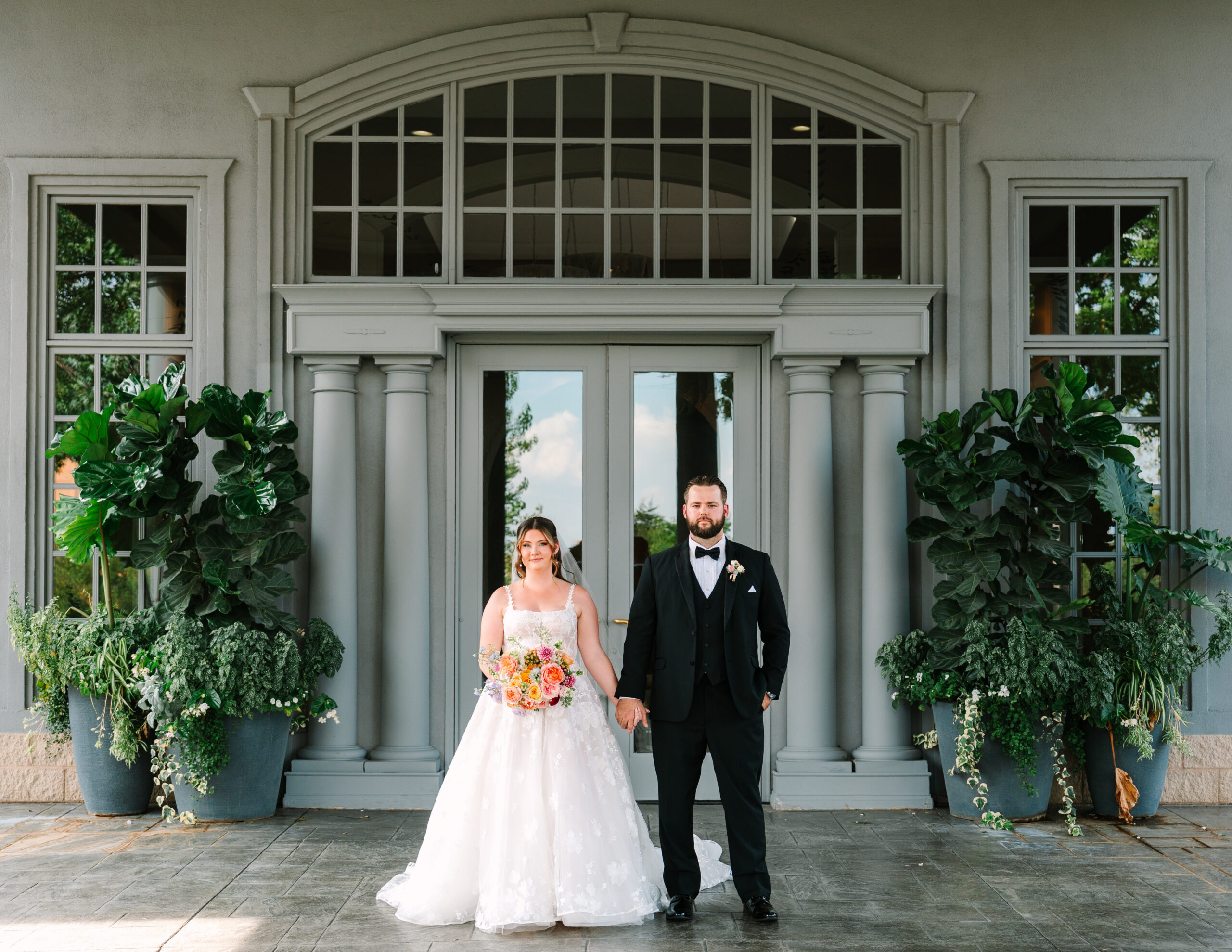 Colorful bridal bouquet with pink and orange flowers