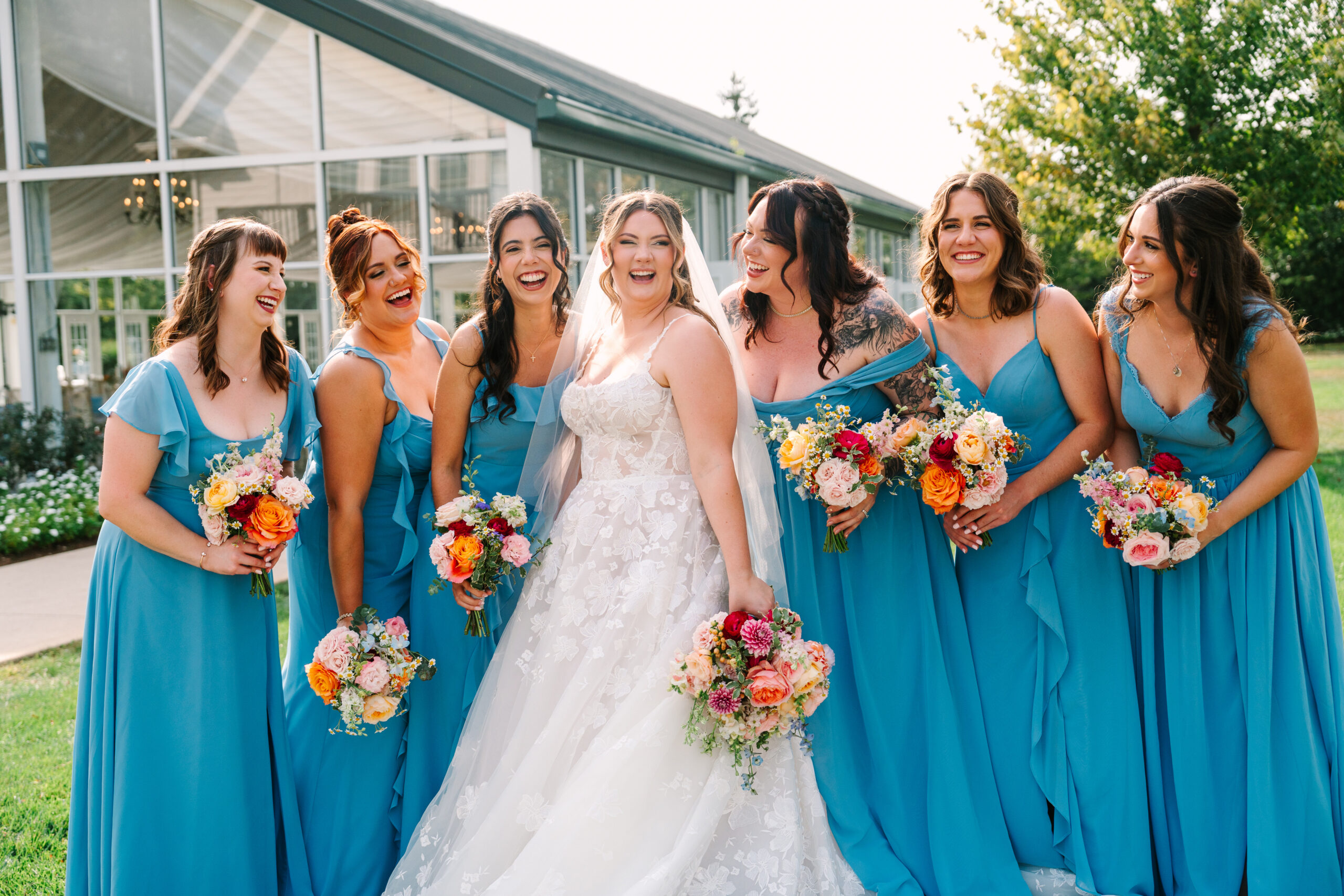 Colorful bridal bouquet with pink and orange flowers