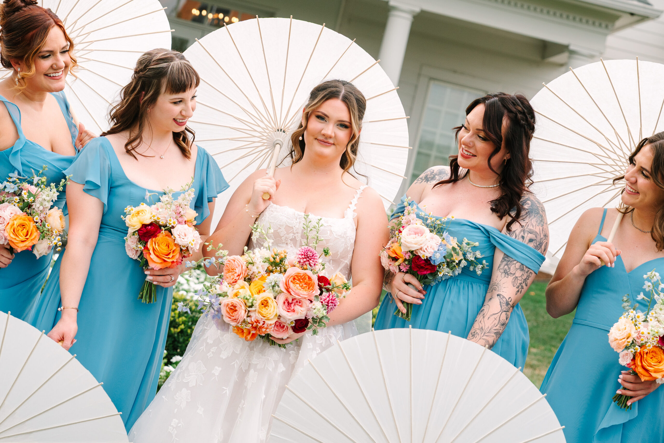 Colorful bridal bouquet with pink and orange flowers